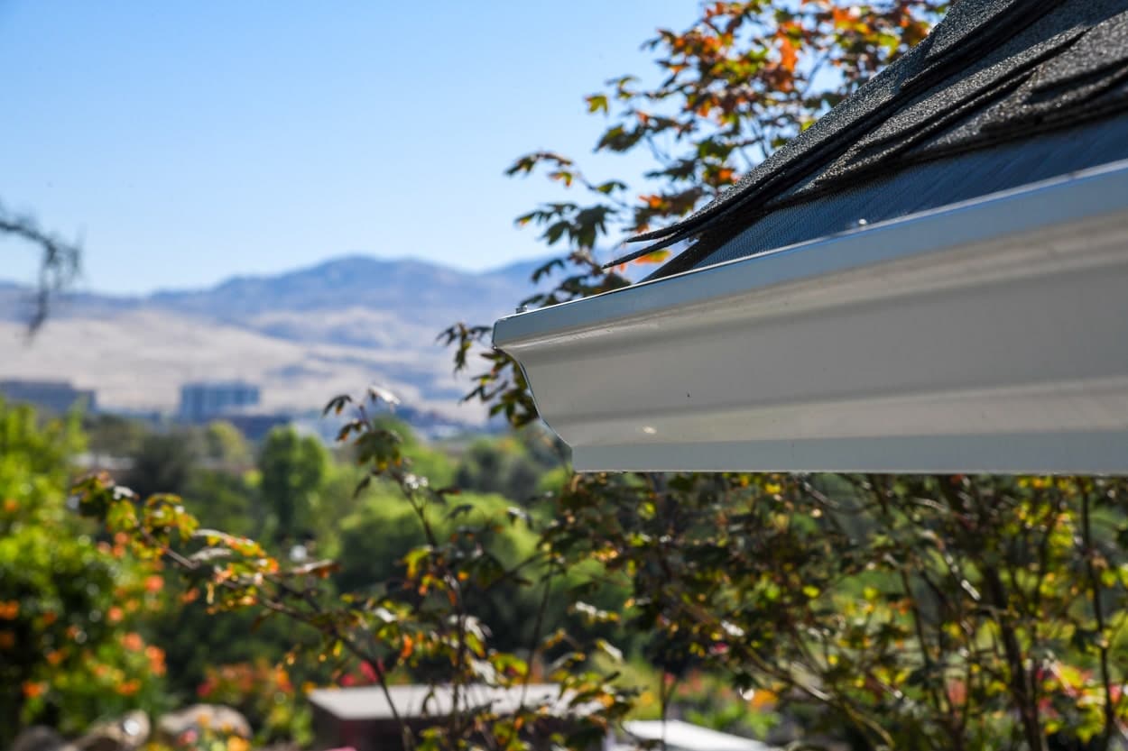 Gutter installed on a house with view downtown boise idaho in the background